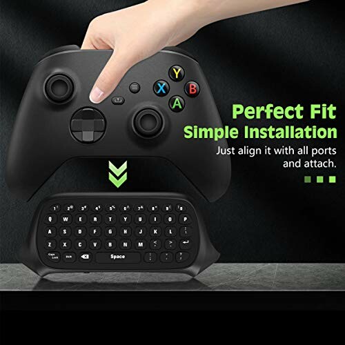 Hand installing keyboard attachment on game controller.