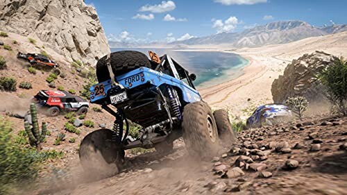 Off-road vehicles racing on rocky terrain near a beach.