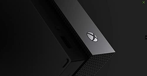 Close-up of Xbox console on dark background