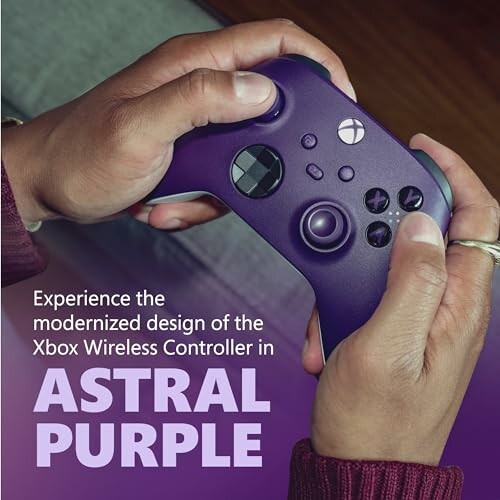 Hands holding Xbox Wireless Controller in Astral Purple.